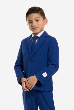Young boy wearing a blue suit on a white background