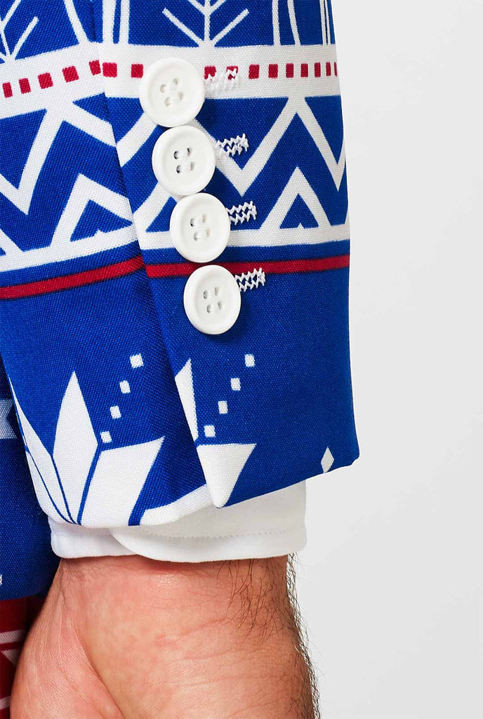 Man wearing blue Christmas suit with Nordic themed print