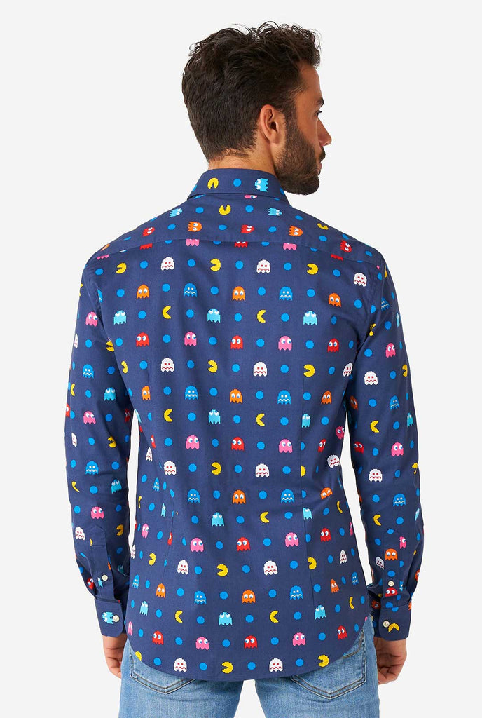 Man wearing blue dress shirt with Pac-Man icons