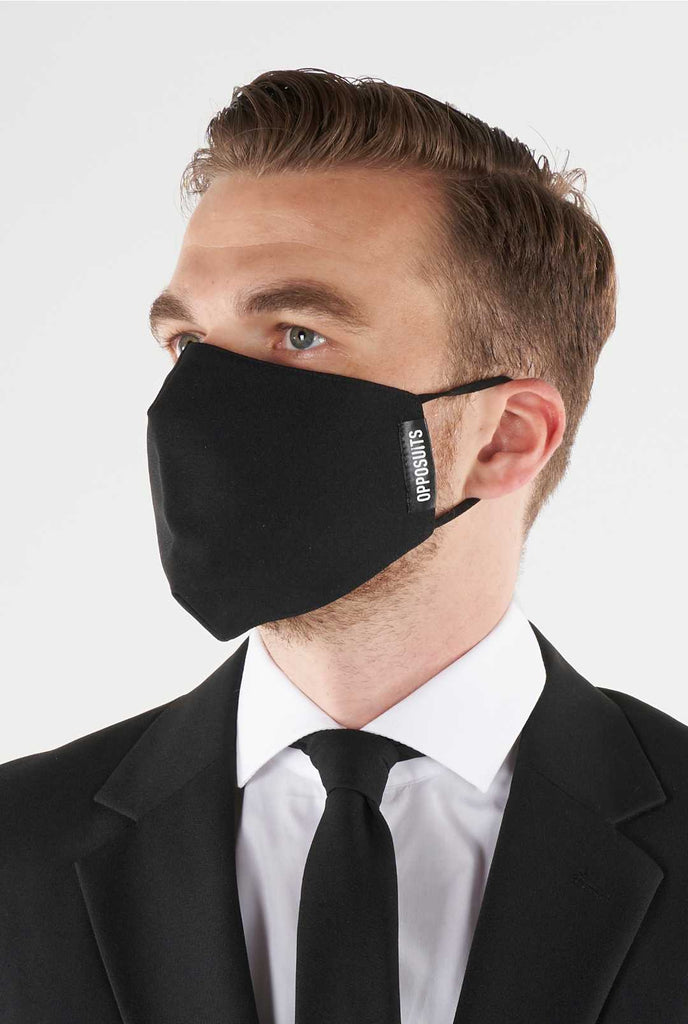 Man wearing face mask made of black fabric
