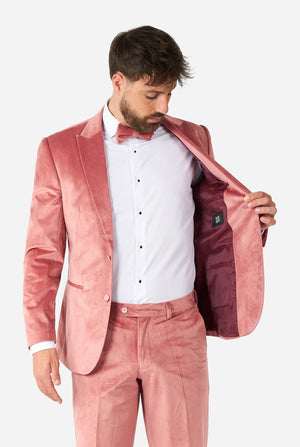Man wearing pink velvet tuxedo