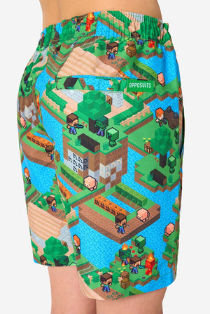 A Teen boy wearing a colorful summer outfit featuring a Minecraft Overworld print, showcasing pixelated landscapes, characters, and elements from the iconic game. The short-sleeve shirt and matching shorts highlight a vibrant design inspired by the Minecraft universe. Focused on the shorts from the back