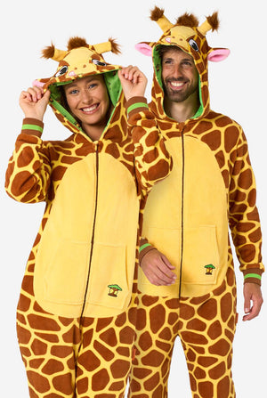 A smiling man and woman are wearing a brown and yellow adult onesie designed as a giraffe. The onesie features a hood resembling a Giraffes head, and giraffe details, perfect for cozy lounging or costume parties.