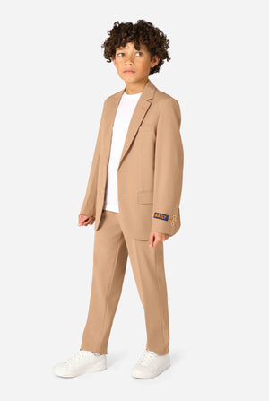 Kid wearing a stylish light brown/ beige suit with a white dress shirt, looking away from the camera. Perfect formal outfit for boys' special occasions, weddings, and parties. Full body image.
