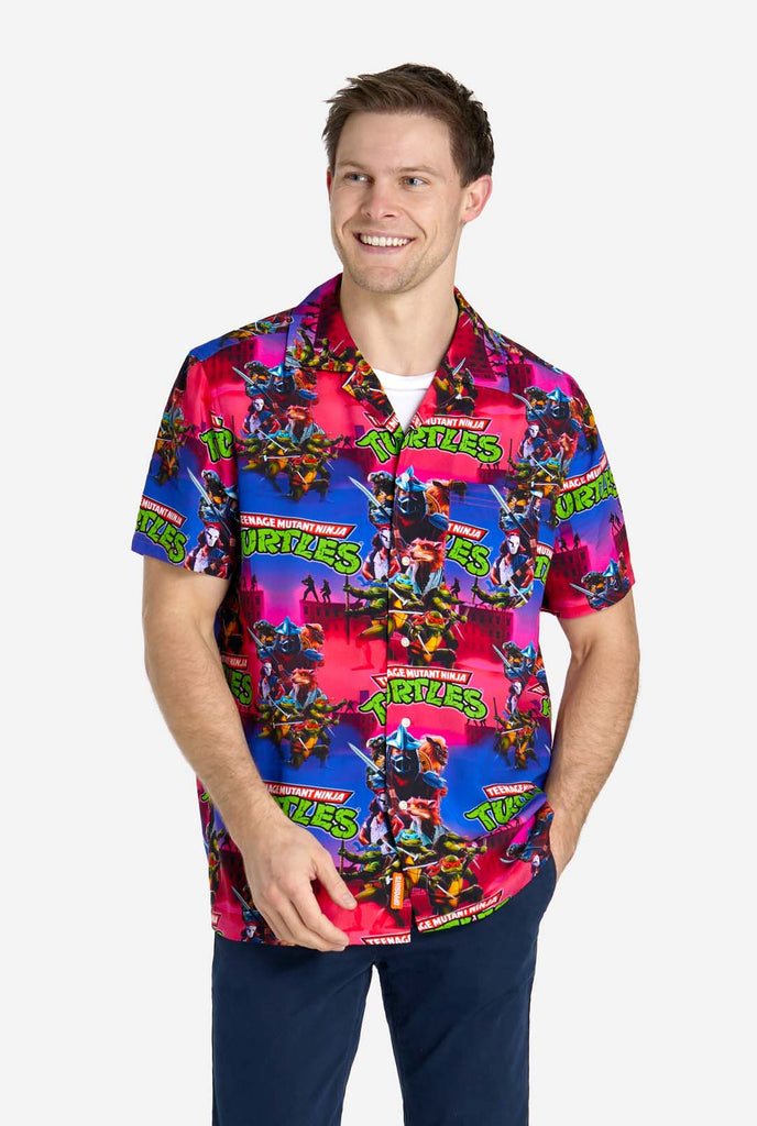 Man wearing Hawaiian Shirt with Teenage Mutant Ninja Turtle print.