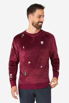 Man wearing velver burgundy red Christmas sweater with Christmas icons
