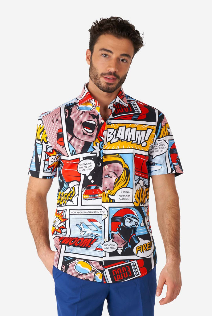 Man wearing summer shirt with Comic book print and blue shorts