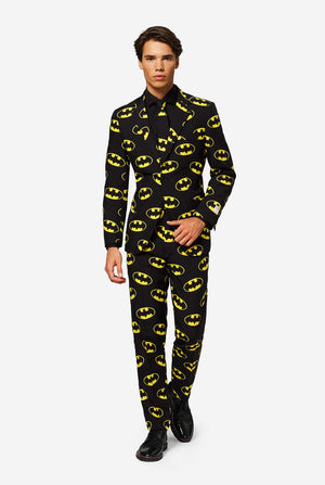 Man wearing Black suit with Yellow Batman logos.