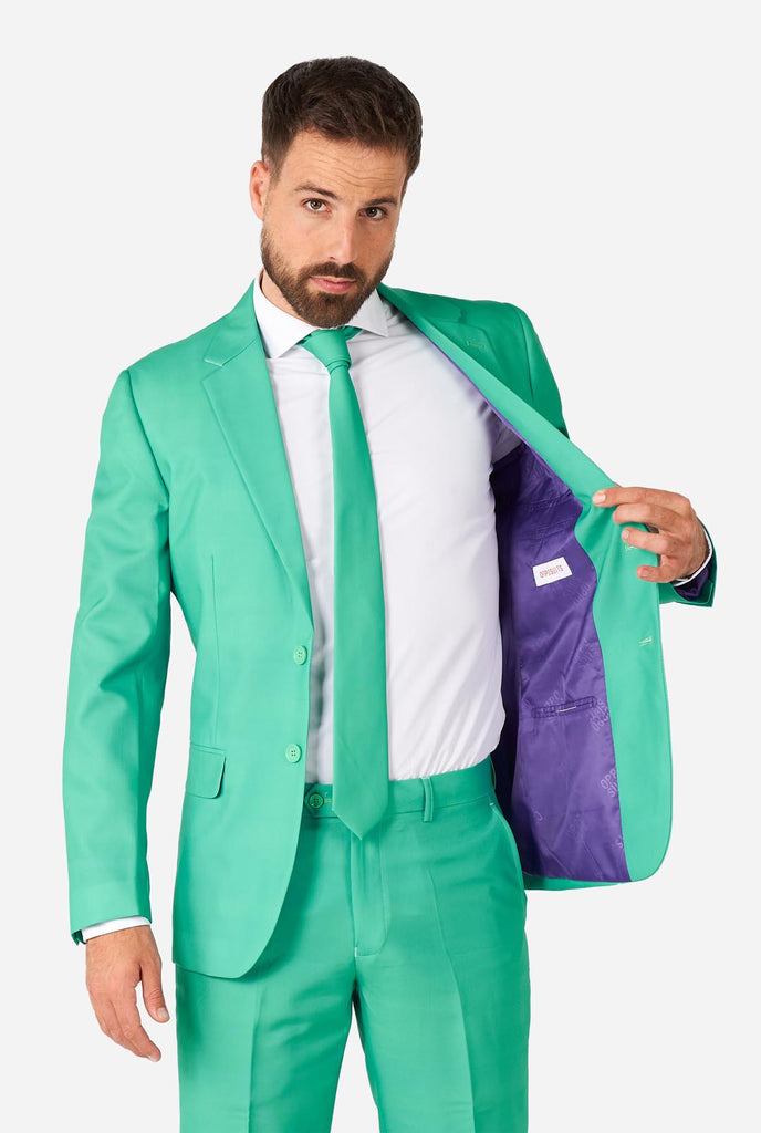 Man wearing turquoise colored suit