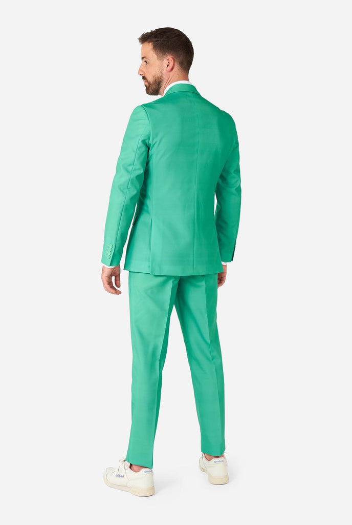 Man wearing turquoise colored suit