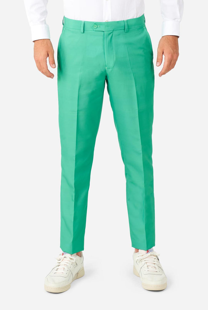 Man wearing turquoise colored suit