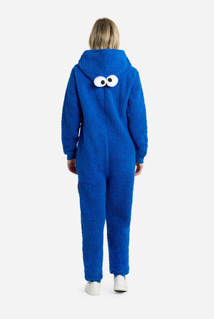 Woman wearing blue pluche Cookie Monster onesie for adults, view from the back