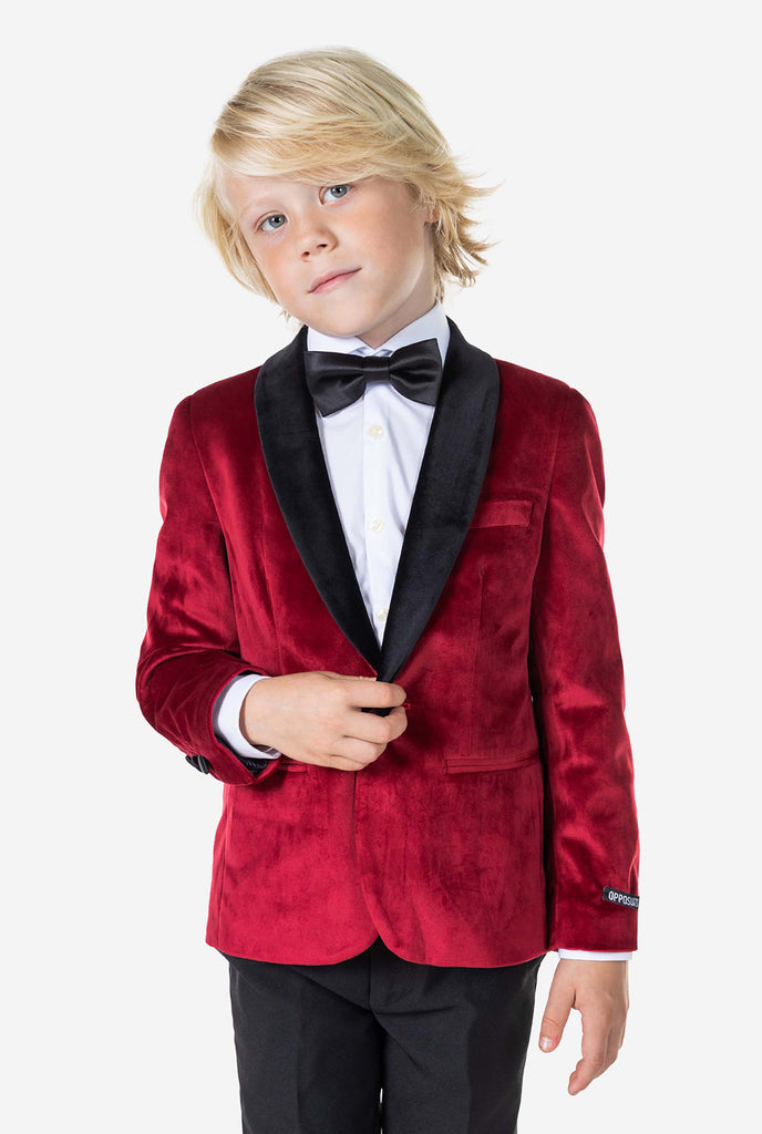 Boy wearing red velvet dinner jacket