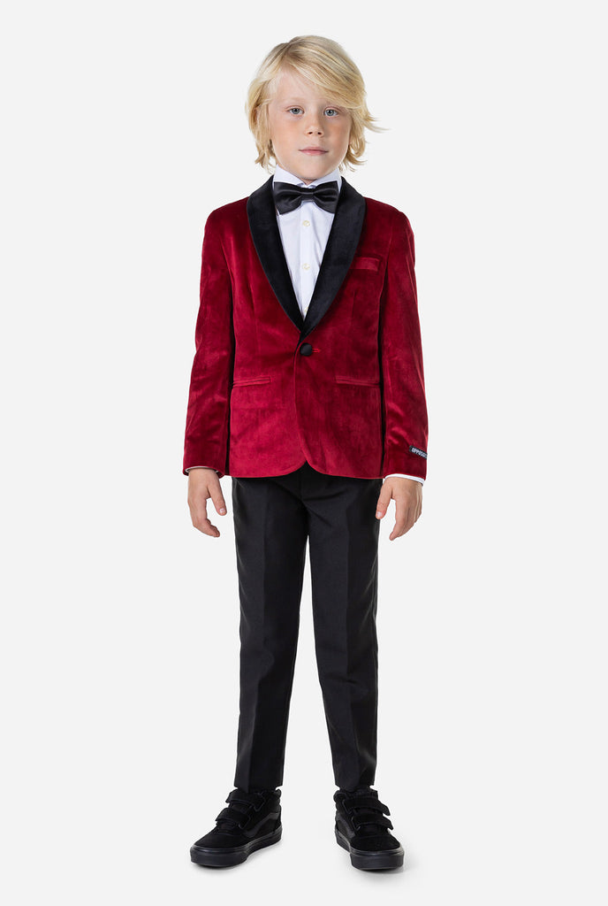 Boy wearing red velvet dinner jacket