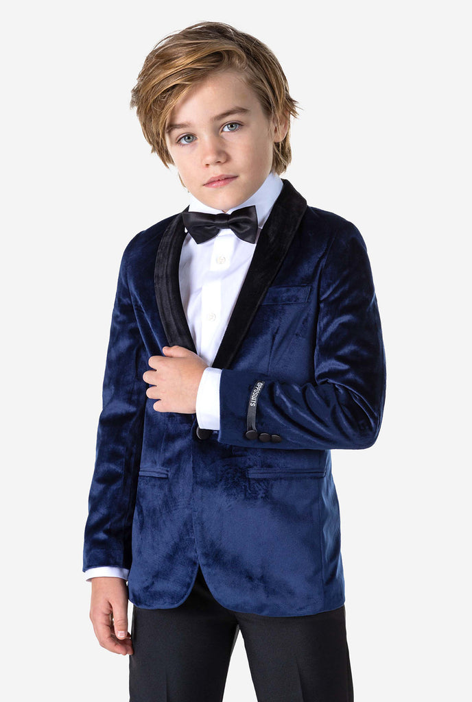 Boy wearing blue velvet Christmas dinner jacket