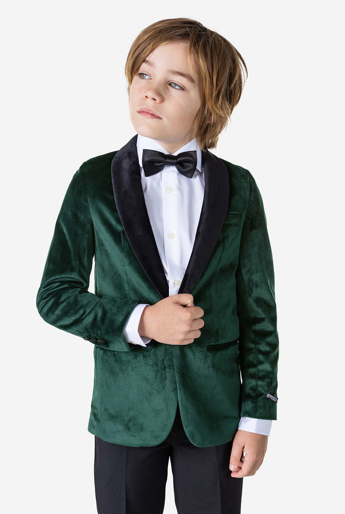 Boy wearing green velvet Christmas dinner jacket