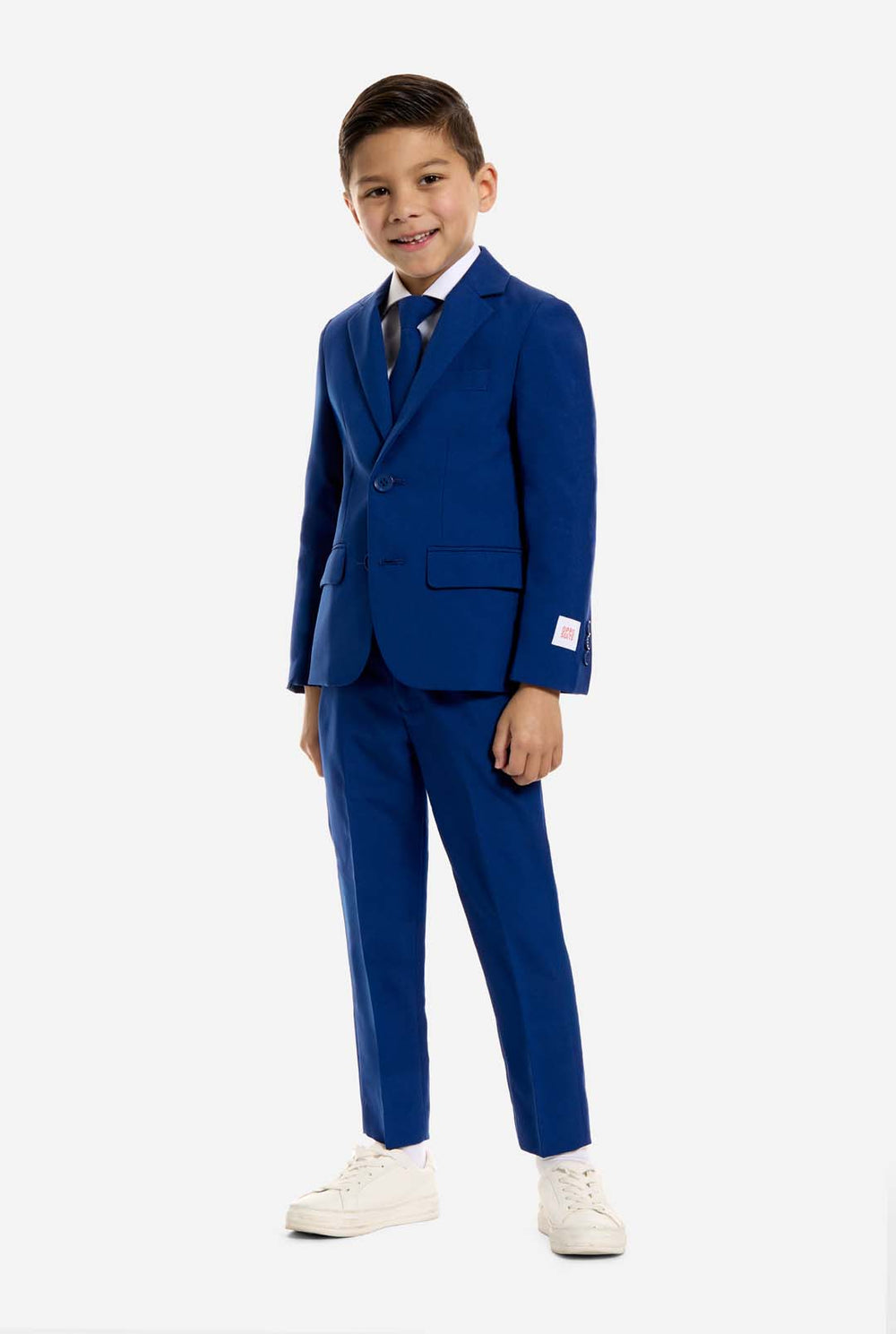 Young boy wearing a blue suit on a white background