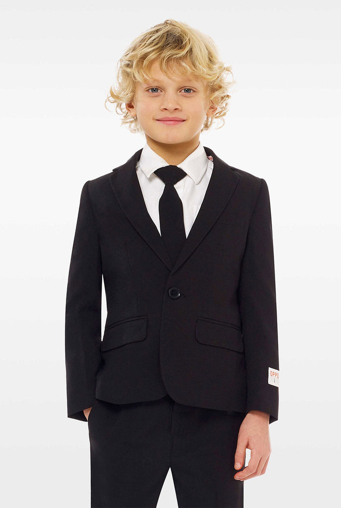 Black suit for boys worn by boy