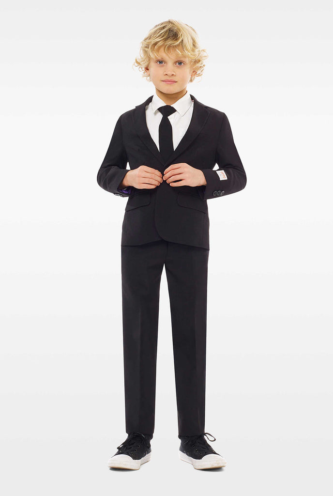 Black suit for boys worn by boy