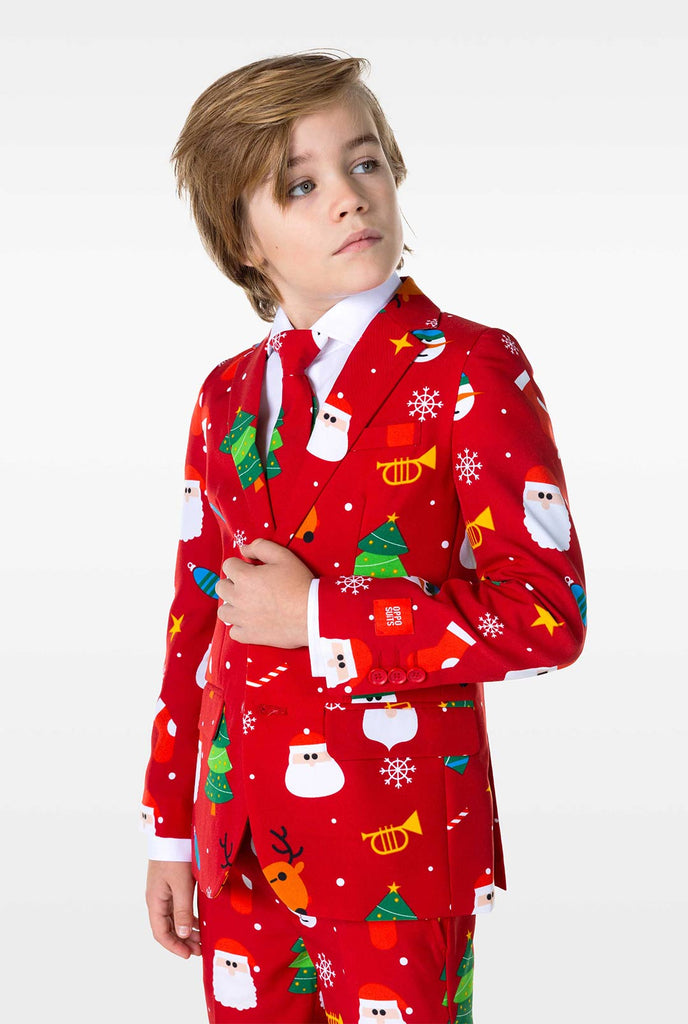 Kid wearing red Christmas suit with Christmas icons