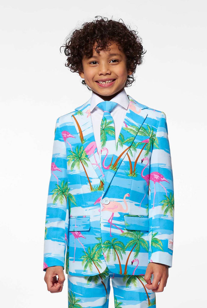 Bright blue tropical suit with flamingo print for boys worn by boy
