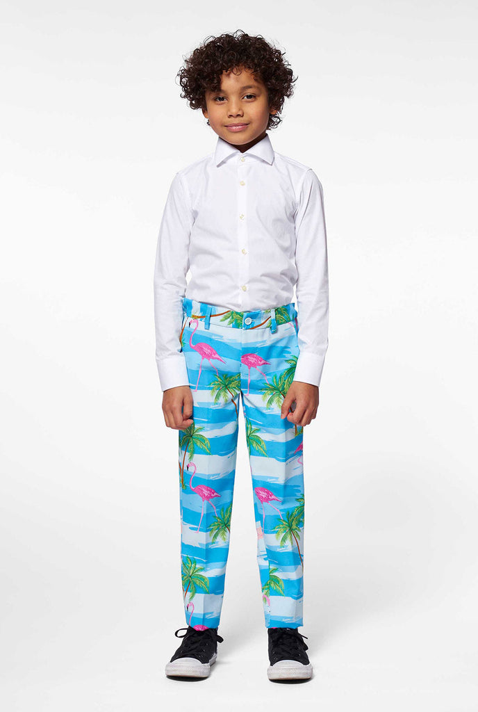 Bright blue tropical suit with flamingo print for boys worn by boy