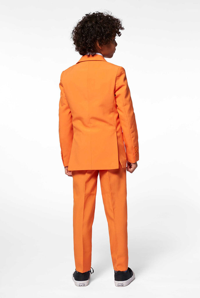 Solid colored orange boys suit worn by boy