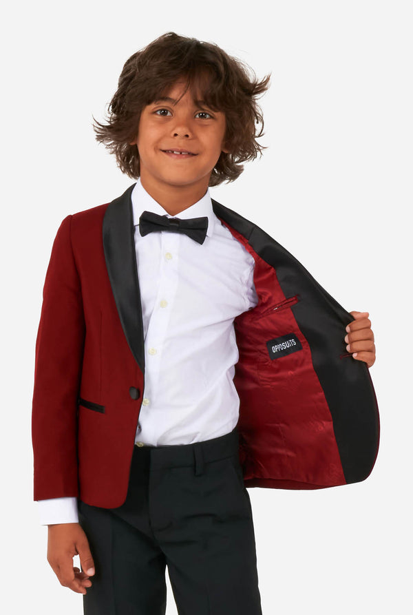 Kid wearing red and black tuxedo
