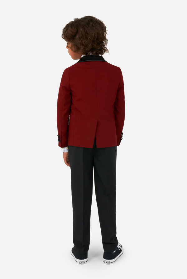 Kid wearing red and black tuxedo