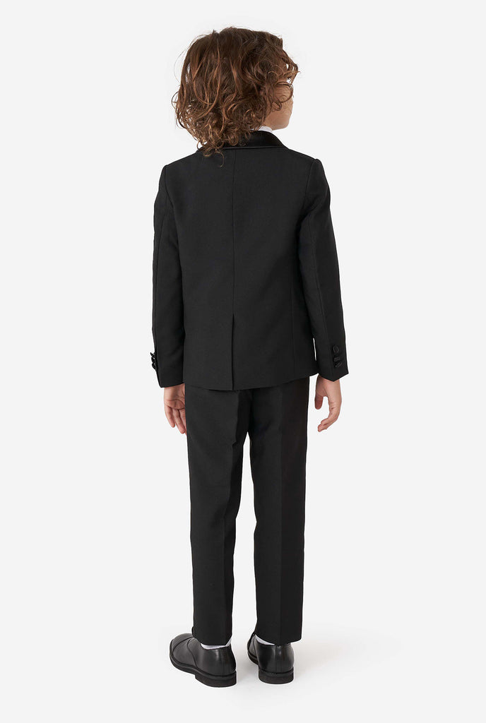 Kid wearing black tuxedo