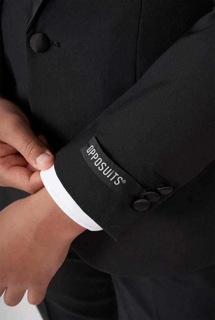 Kid wearing black tuxedo