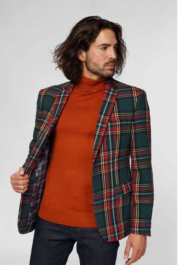 Red and green tartan blazer worn by man