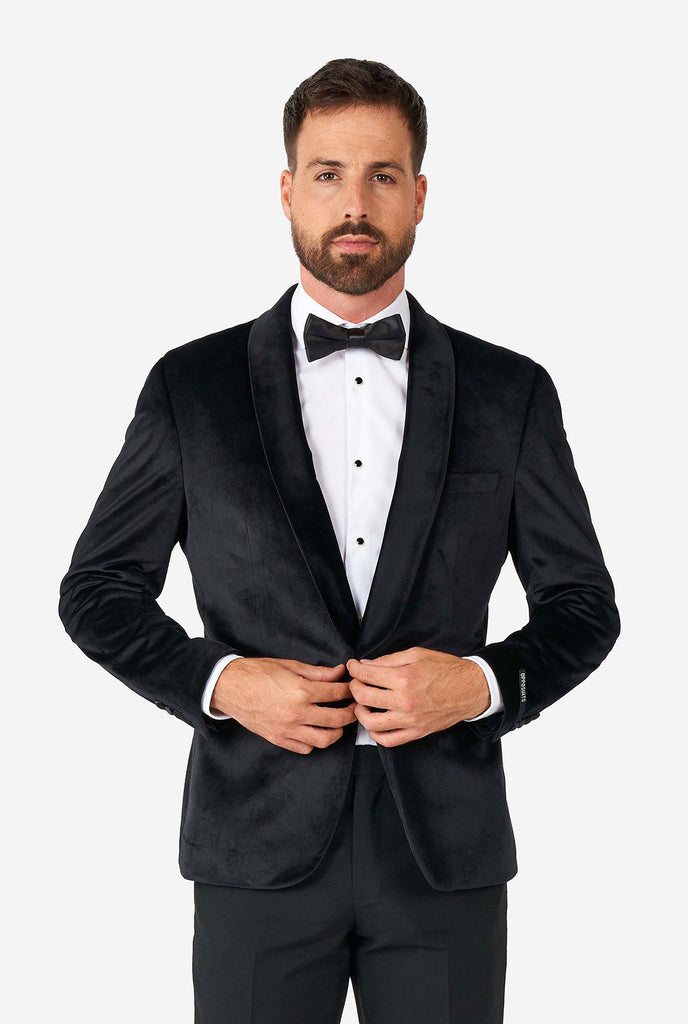 Man wearing black velvet dinner jacket blazer