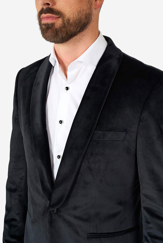 Man wearing black velvet dinner jacket blazer