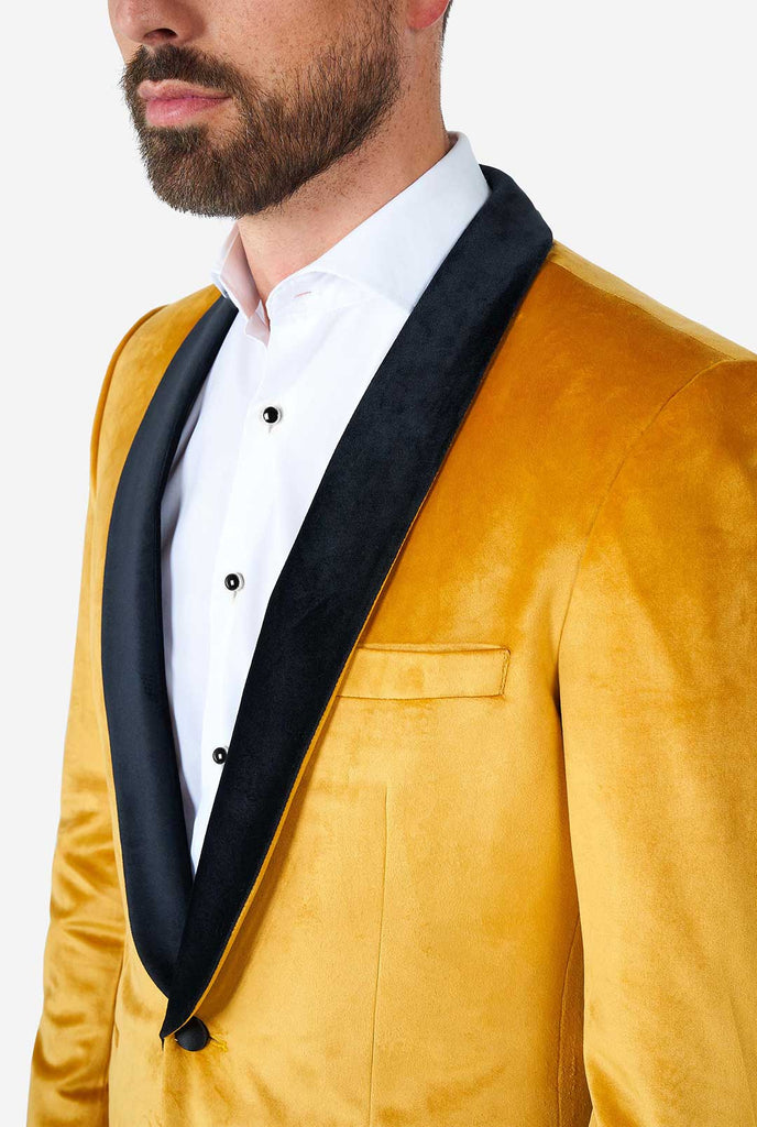 Man wearing golden velvet dinner jacket blazer