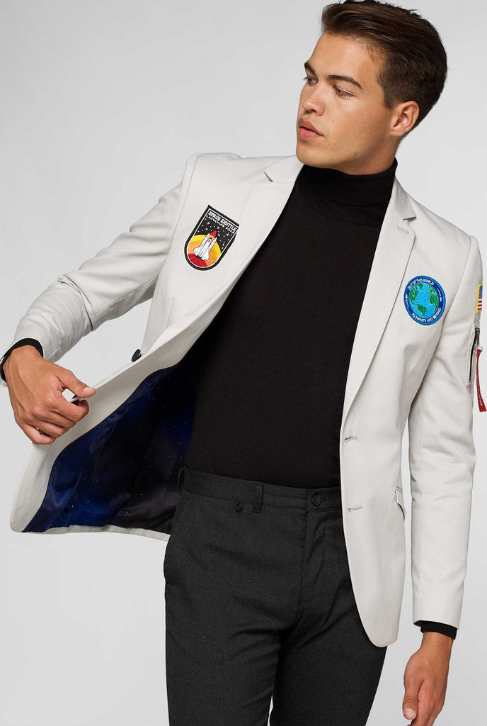 Light grey casual blazer with astronaut themed patches worn by man