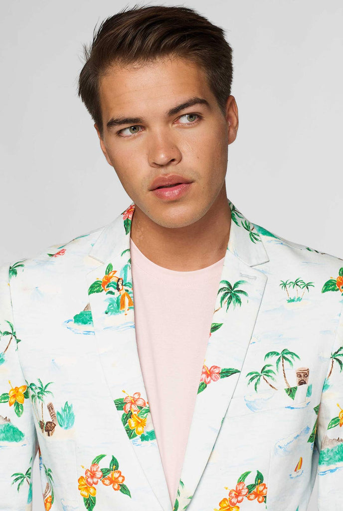 White casual blazer with Hawaiian icon print worn by man showing red palm tree inner lining