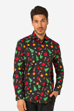Man wearing a black festive patterned shirt with colorful Christmas designs on a white background