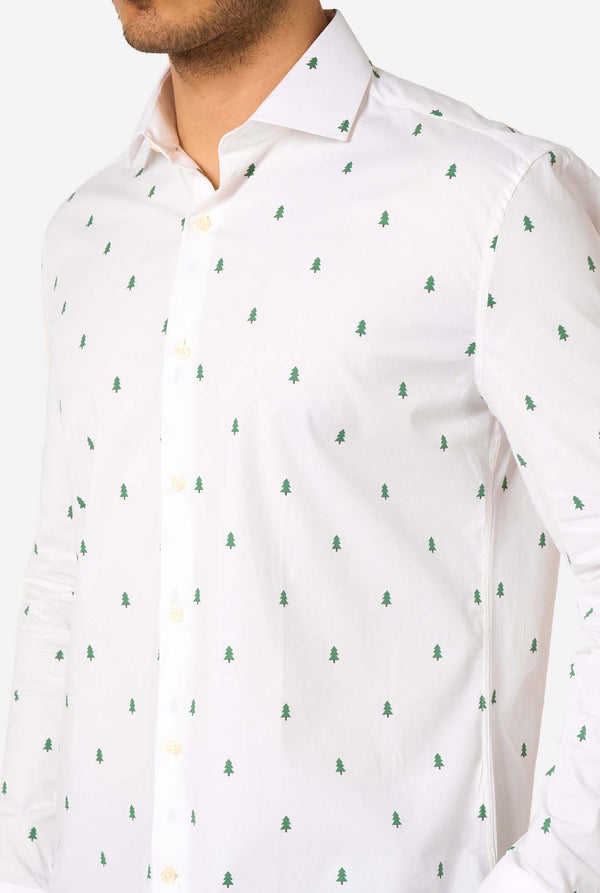 Man wearing a white shirt with a subtle Christmas tree pattern on a white background. Close up of the chest