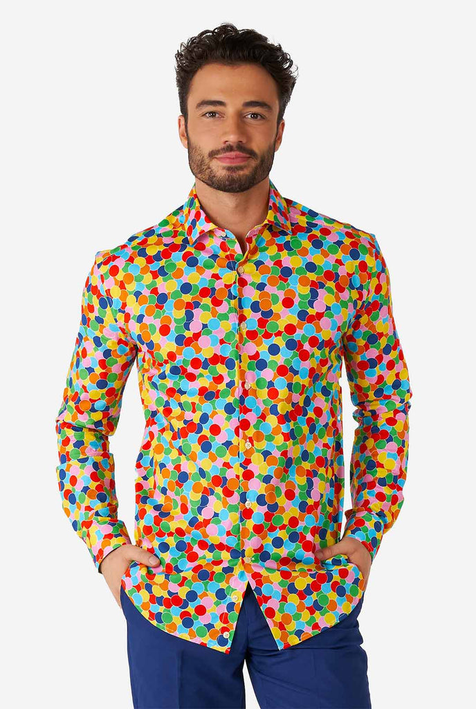 Man wearing multi color dress shirt with confetti print