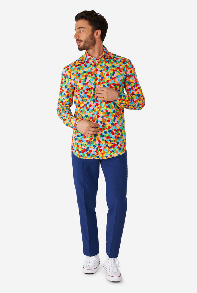 Man wearing multi color dress shirt with confetti print