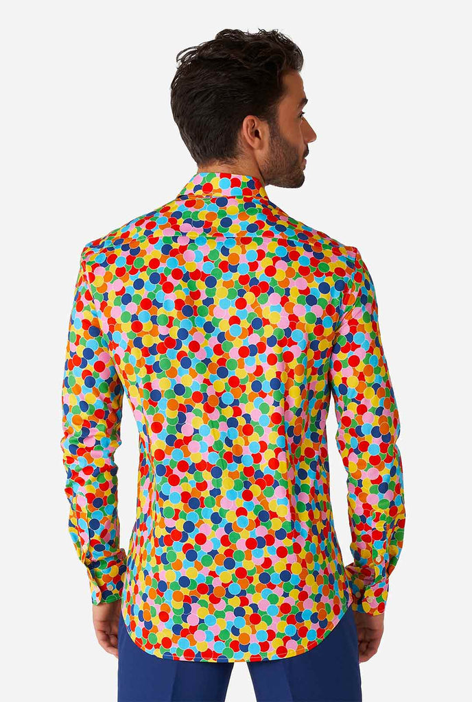 Man wearing multi color dress shirt with confetti print