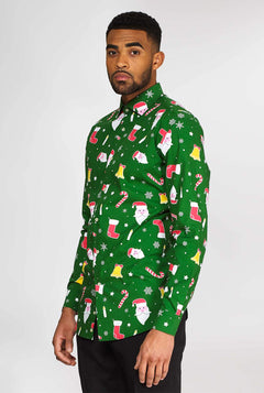 Man wearing green Christmas dress shirt with Christmas icons