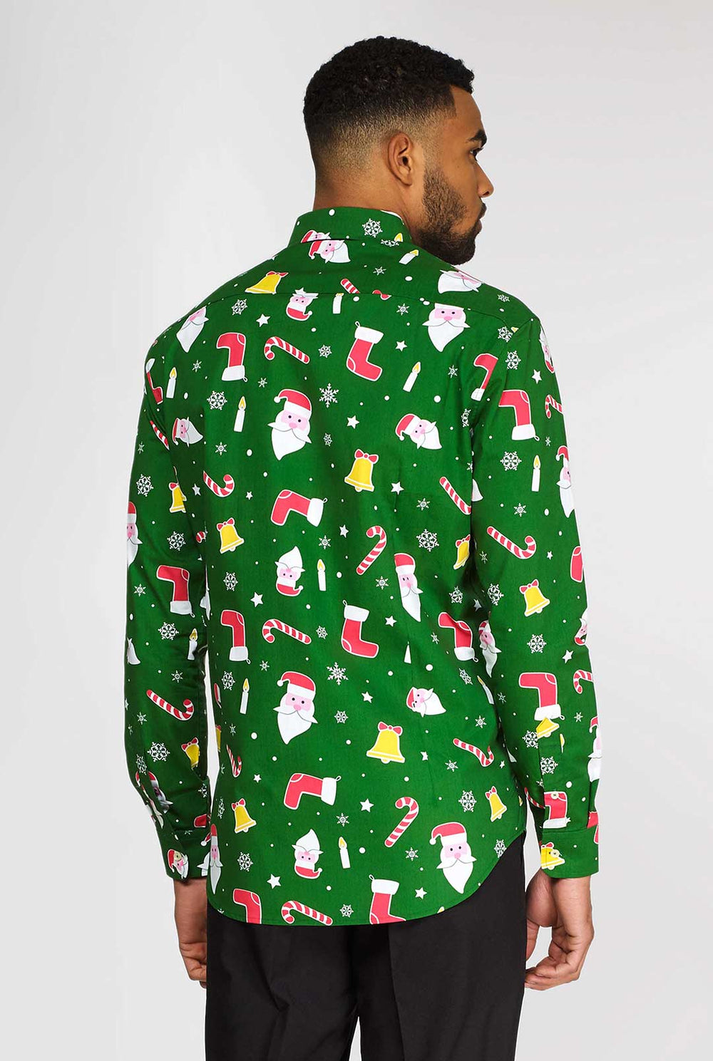 Man wearing green Christmas dress shirt with Christmas icons