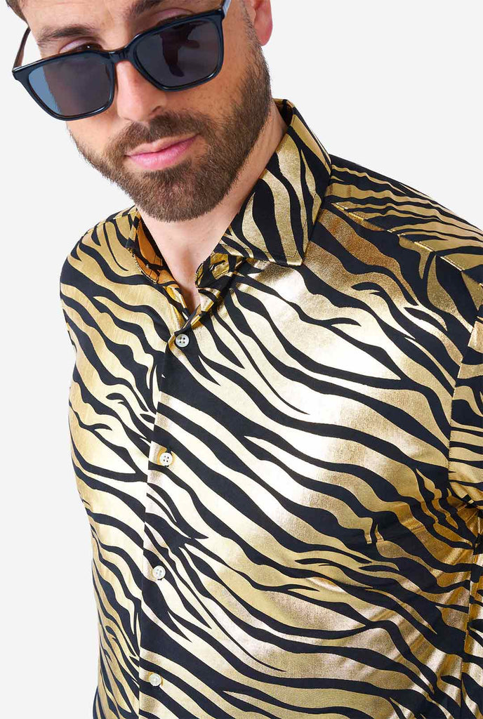 Man wearing golden dress shirt with tiger stripes