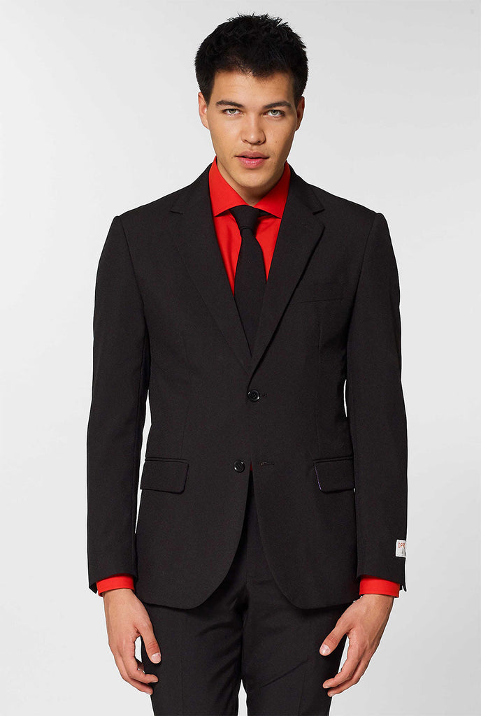 All black men's suit worn by man