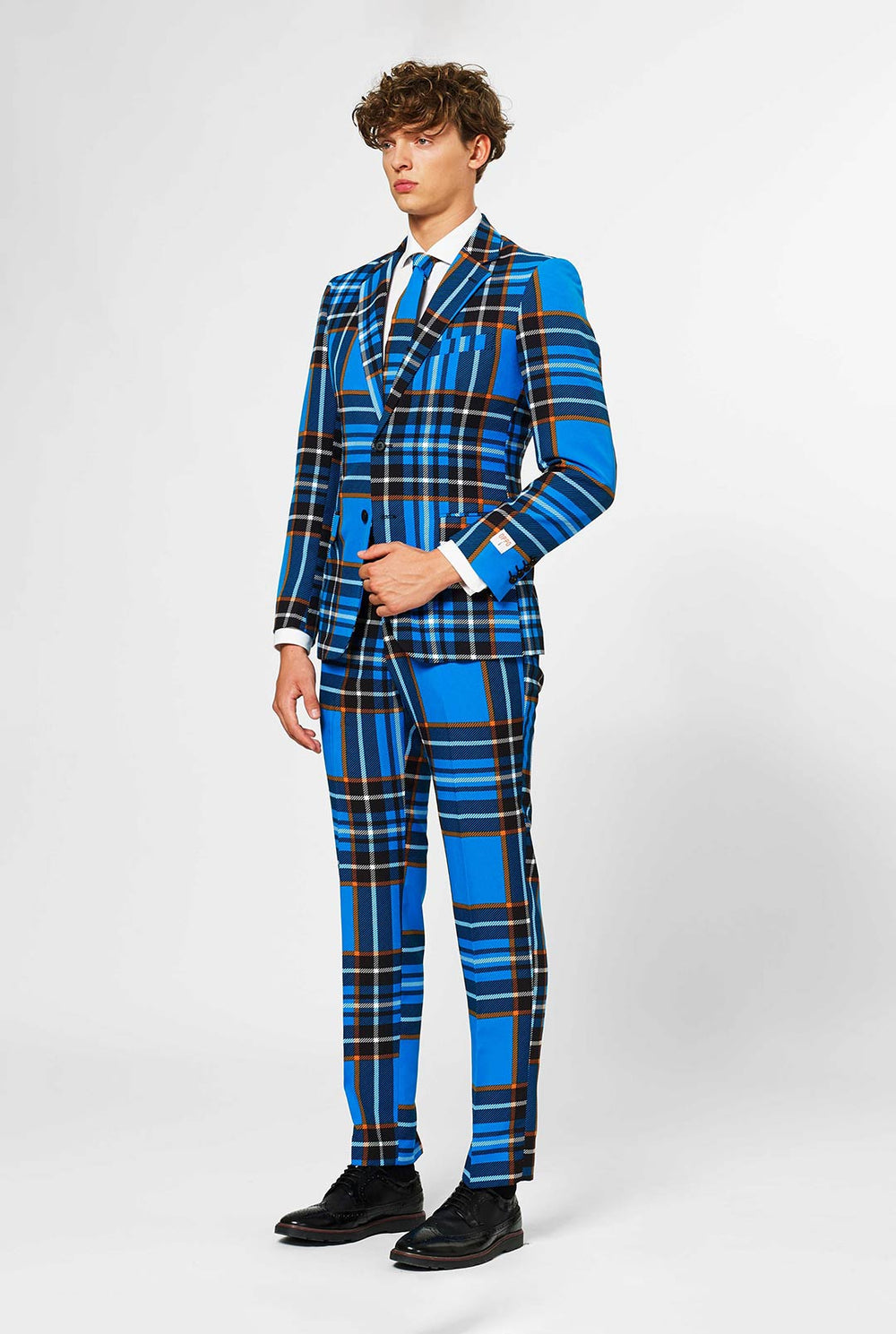 Man wearing blue tartan men's suit 