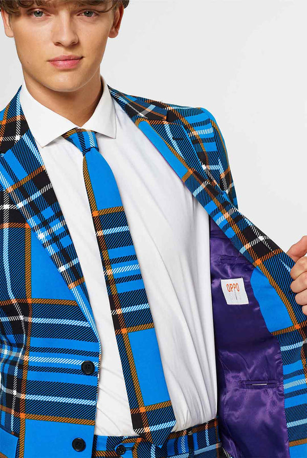 Man wearing blue tartan men's suit 