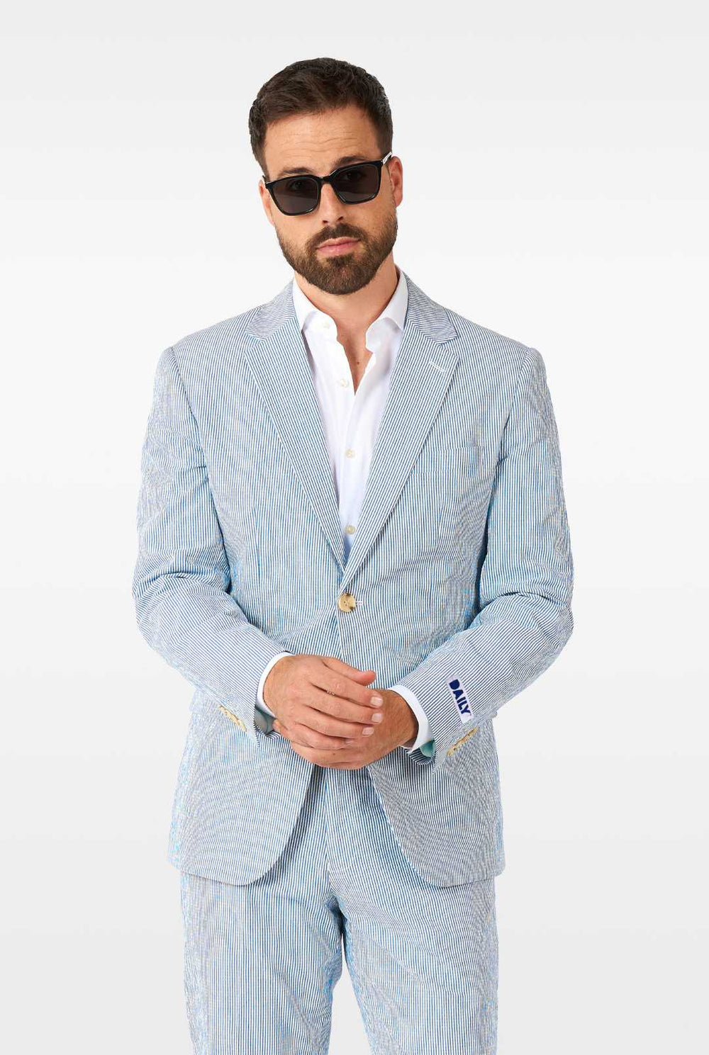 Man wearing stripped blue and white seer sucker suit
