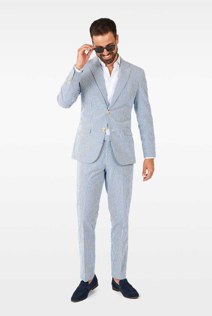 Man wearing stripped blue and white seer sucker suit